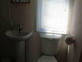 A bathroom with a sink and a toilet at 84 Sandhills in Ingoldmells