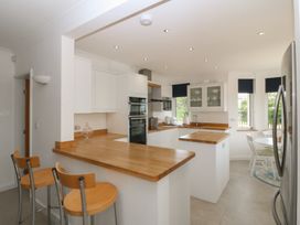A kitchen with a central island and appliances at Hillside