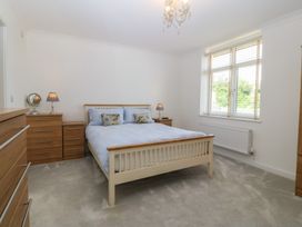 A bedroom with a bed and dresser at Hillside