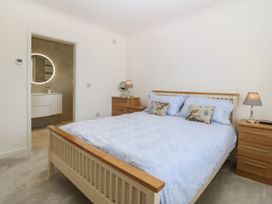 A bedroom with a bed and nightstands at Hillside