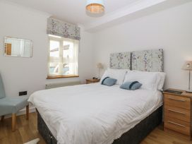 A bedroom with a bed and furniture at Hillside 