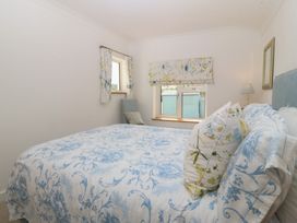 A bedroom with a bed and window at Hillside