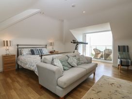 A bedroom with a bed and seating area at Hillside
