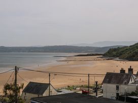 A beach view with hills in the background at Hillside