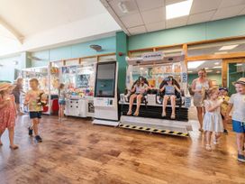 Children playing and enjoying ice cream at Tide’s Reach - Hayling Island