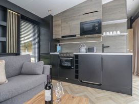 A kitchen with a countertop and appliances at Heron in Haverigg