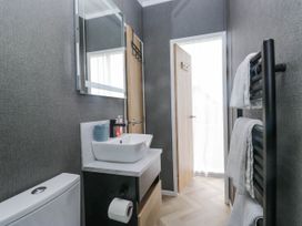 A bathroom with a sink and toilet at Heron in Haverigg