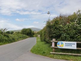A road with a sign for Harbour Lights Campsite in Haverigg