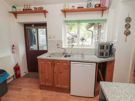 A kitchen with a sink and appliances at The School House in Patterdale near Glenridding
