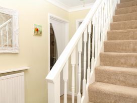 A staircase in a hallway at Marldon Mews in Marldon