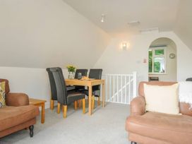 A dining area with a table and chairs at 9 Honicombe Park in Callington