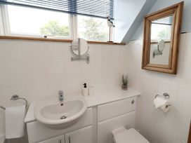 A bathroom with sink and toilet at Sarah's Cottage