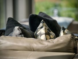 A sofa with patterned cushions at Midways in Windermere