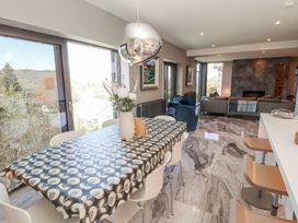 A dining room with a table and chairs at Midways in Windermere