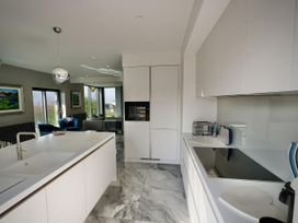 A kitchen with modern appliances and a stove at Midways in Windermere