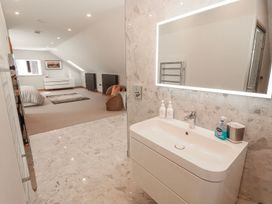 A bathroom with a sink and mirror at Midways in Windermere