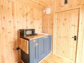 A kitchen with a microwave and sink at Laurel near Littleport