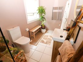 A bathroom with a sink and toilet at Bull Rush Cabin Carwinley near Longtown