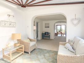 A living room with sofas and a coffee table at Bryn Llifon in Pentraeth