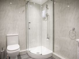 A bathroom with a shower and toilet at Bryn Llifon in Pentraeth