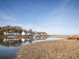 A coastal view with houses and boats at Bryn Llifon in Pentraeth