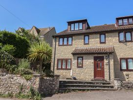 A house with a stone facade and windows at Seaview in Lyme Regis