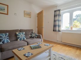 A living room with a sofa and coffee table at Seaview in Lyme Regis