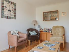 A living room with chairs and a table at Seaview in Lyme Regis