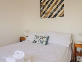 A bedroom with a bed and nightstand at Seaview in Lyme Regis