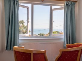 A living room with a window view at Seaview in Lyme Regis
