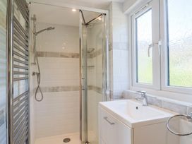 A bathroom with a shower and sink at Seaview in Lyme Regis