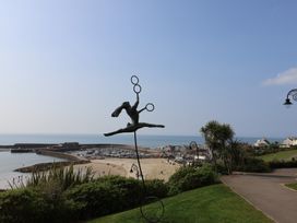 A sculpture overlooking the beach and ocean at Seaview in Lyme Regis