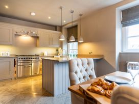 A kitchen with a stove and sink at Prospect House in Windermere