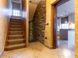 A hallway with stairs leading to the upper level at Prospect House in Windermere