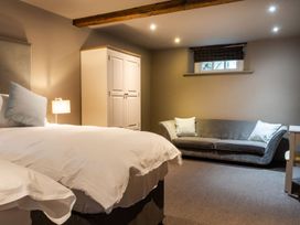 A bedroom with a bed and wardrobe at Prospect House in Windermere