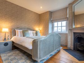 A bedroom with a bed and lamp at Prospect House in Windermere