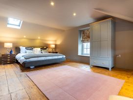 A bedroom with a bed and wardrobe at Prospect House in Windermere