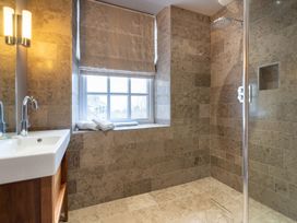 A bathroom with a shower and sink at Prospect House in Windermere