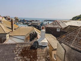 A view of boats in the harbor from rooftops at Stones Throw in Mevagissey