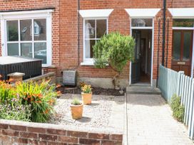 A front yard with plants and a pathway at 19 Covert Road Reydon