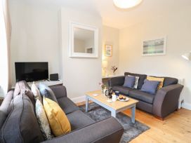 A living room with a couch and coffee table at 19 Covert Road in Reydon