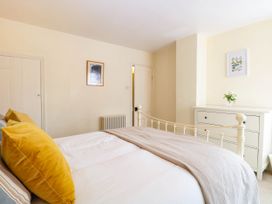 A bedroom with a bed and a dresser at 19 Covert Road in Reydon