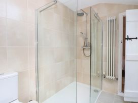 A bathroom with a shower and toilet at 19 Covert Road in Reydon