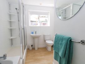 A bathroom with shower, toilet, and sink at 19 Covert Road, Reydon