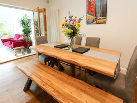 A dining room with a table and chairs at 29 Bincleaves Road Weymouth