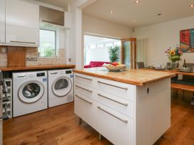 A kitchen with washing machine and dryer at 29 Bincleaves Road Weymouth