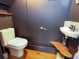 A bathroom with a toilet and sink at 29 Bincleaves Road in Weymouth