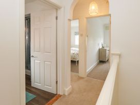 A hallway with doors and a shower in view at 29 Bincleaves Road Weymouth