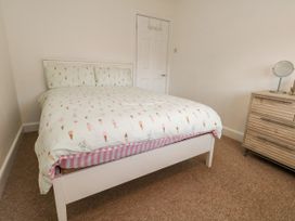A bedroom with a bed and dresser at 29 Bincleaves Road Weymouth