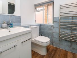 A bathroom with a wash basin and toilet at 29 Bincleaves Road Weymouth
